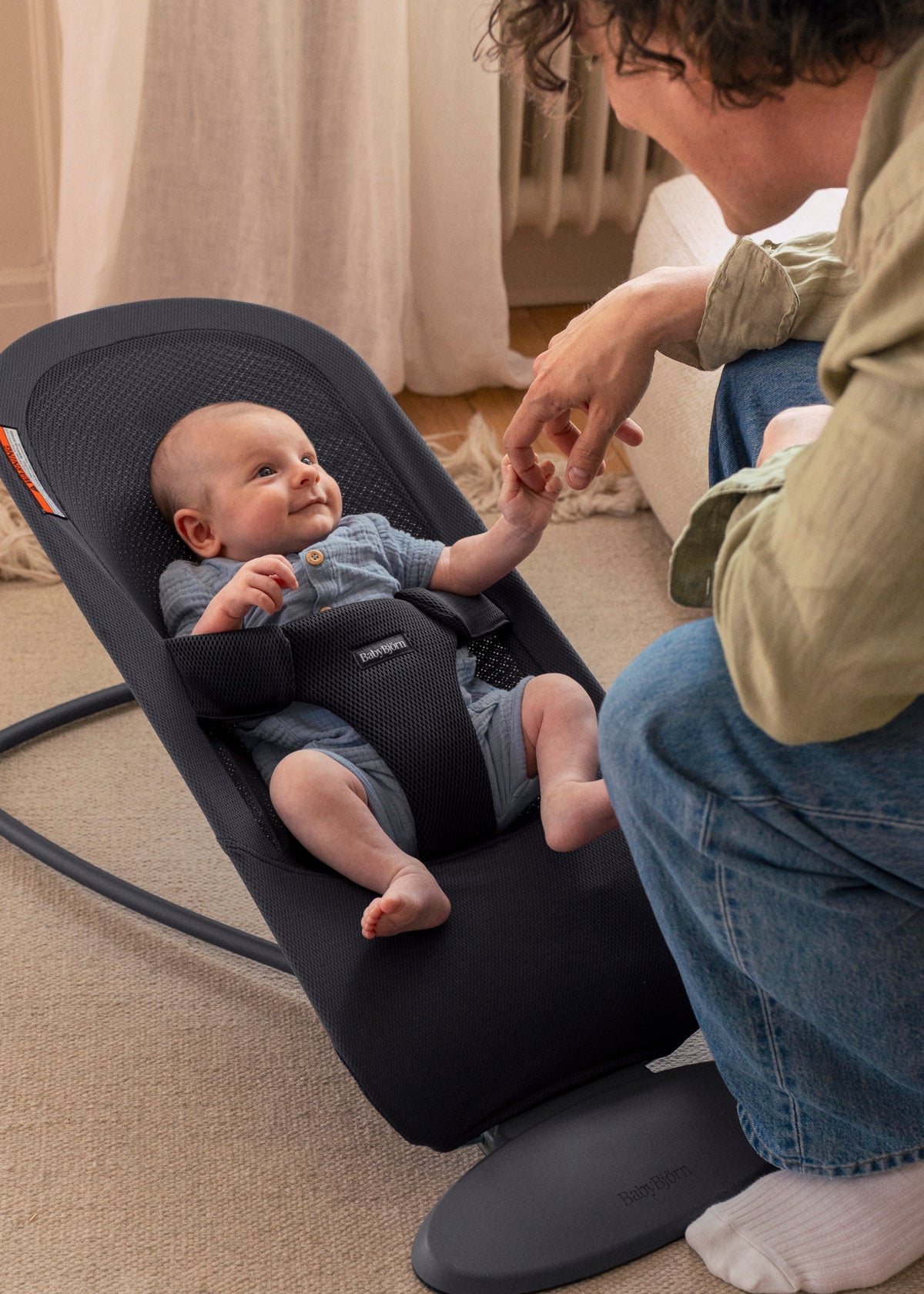 BabyBjorn Bouncer Begin in dark gray airy mesh, in use