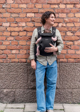 BabyBjorn Baby Carrier Hold in black airy mesh, worn outward-facing