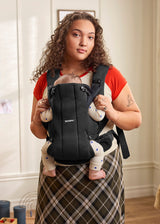 BabyBjorn Baby Carrier Hold in black airy mesh, side view
