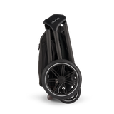Nuna TRIV LX Stroller in Caviar - folded self-standing
