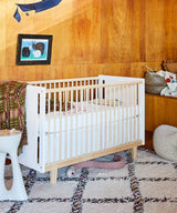 Rhea crib with modern design and safe, adjustable mattress support