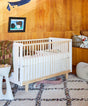 Rhea crib with modern design and safe, adjustable mattress support