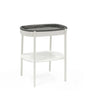 Stokke Sleepi Changing Table – sleek wooden diaper changing station with open storage shelves and soft curved edges for modern nurseries.