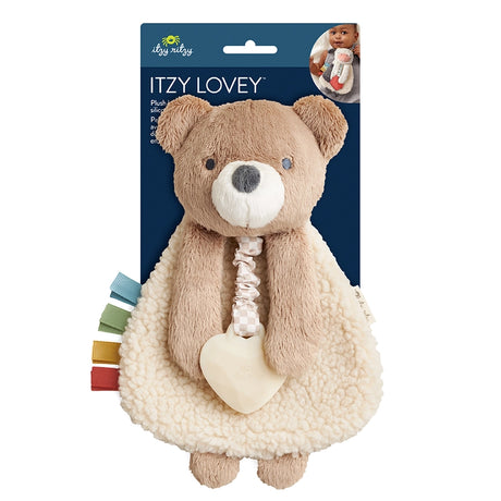 Soft plush Theo the Bear Itzy Lovey™ with embroidered smile, designed for toddlers to cuddle and self-soothe during naps or travel. Hypoallergenic fabric promotes sensory comfort.