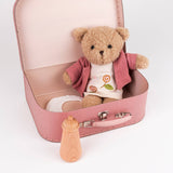 Morrissette With Clothes In A Case